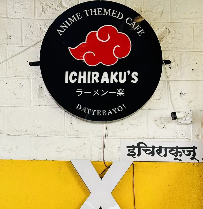 Ichiraku's round black signboard with the red cloud, above the entrance